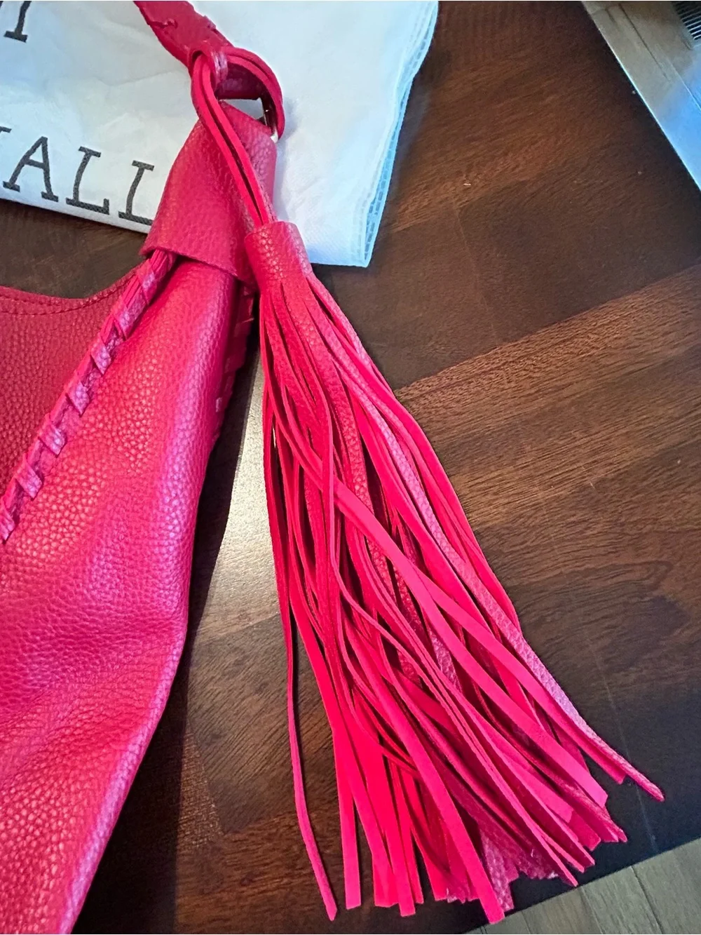 Mark & Hall shoulder Red pebbled Hobo Bag with Braided Trim and red tassel.